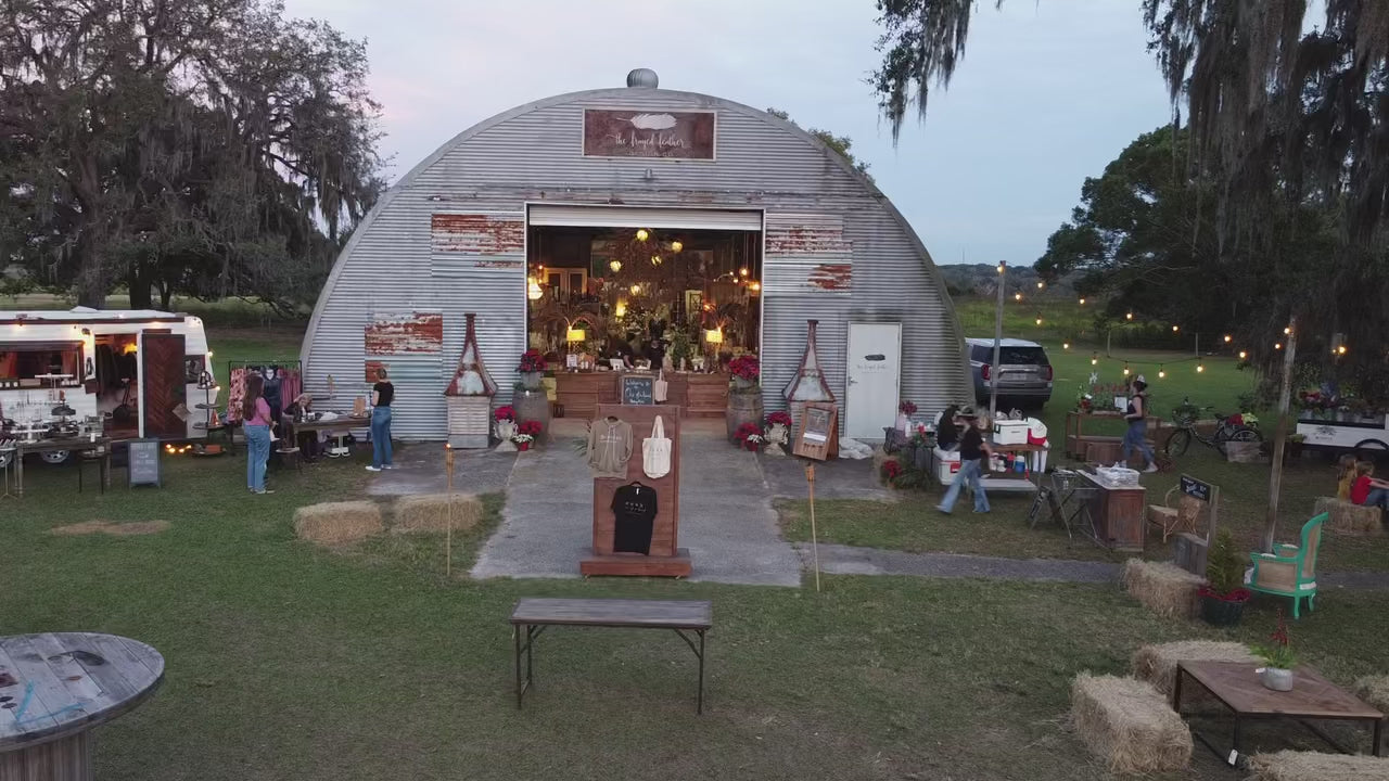 Load video: The Design Barn's annual vintage market with vendors and visitors.